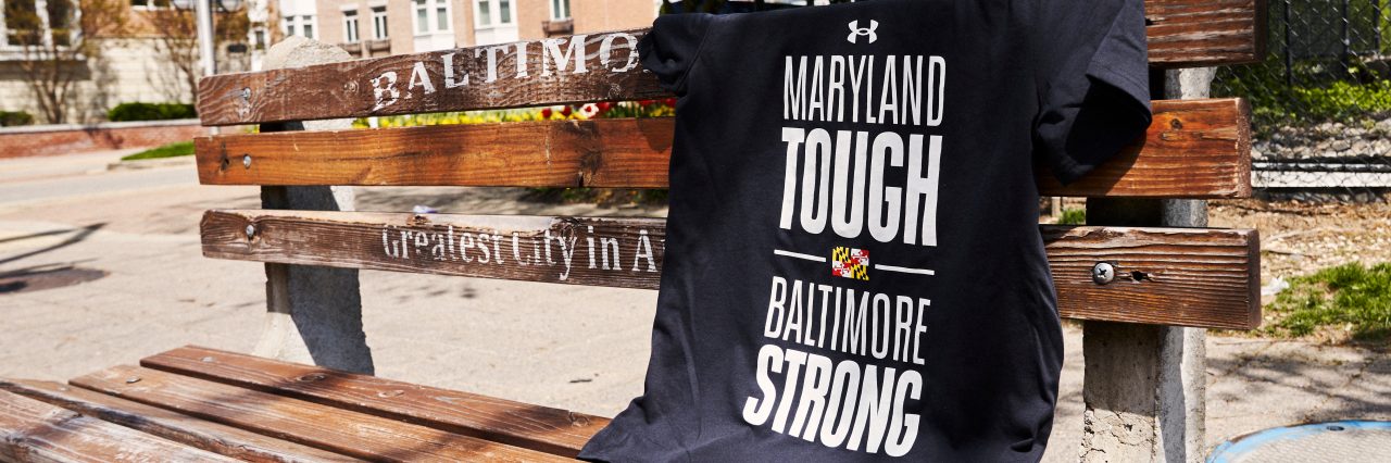 Black maryland tough baltimore strong tshirt on a bench