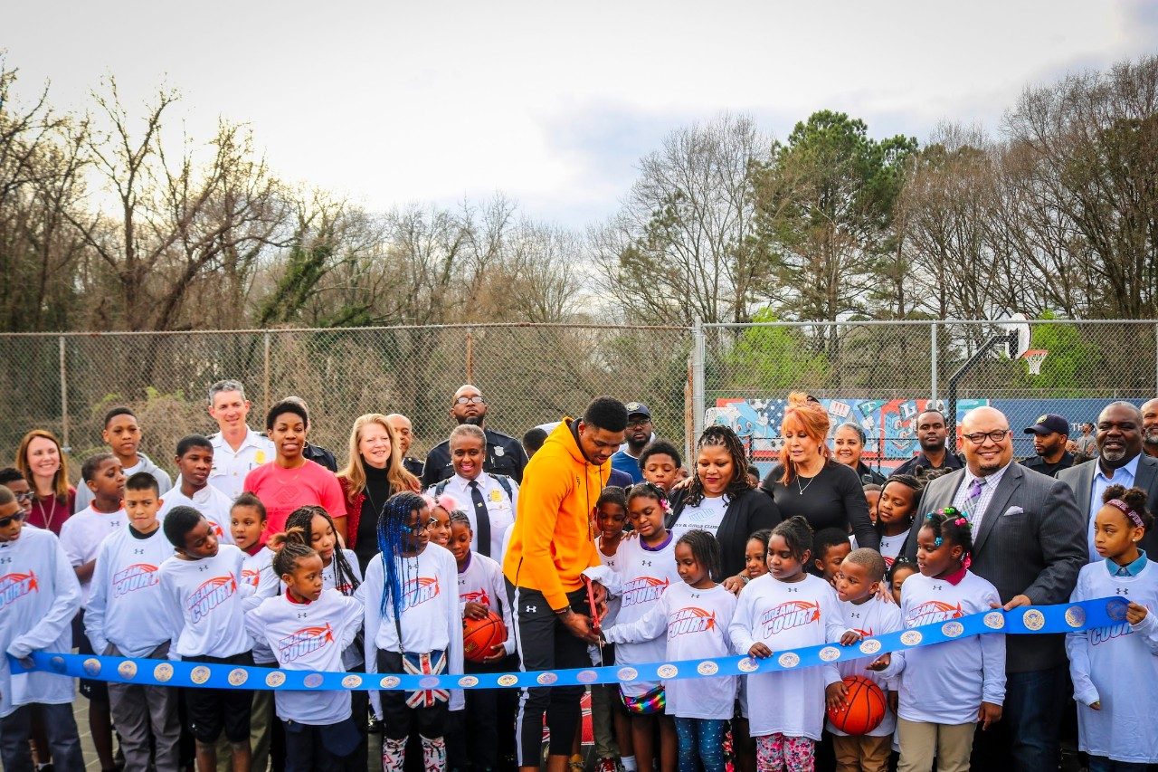 Bazemore leads the ribbon cutting ceremony