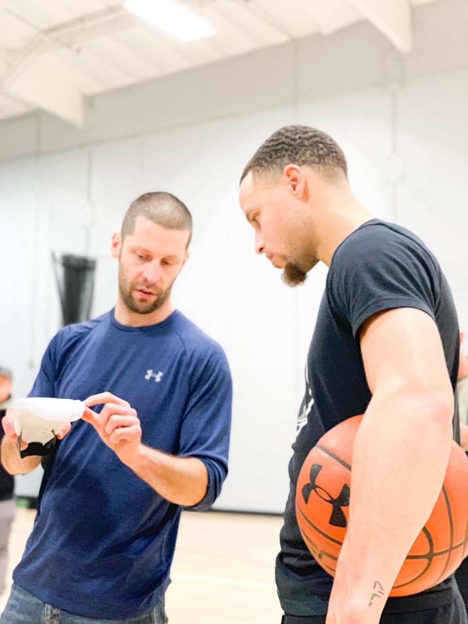Tom Luedecke and Stephen Curry at an early development meeting in Portland for the Curry Flow 8 in 2019.