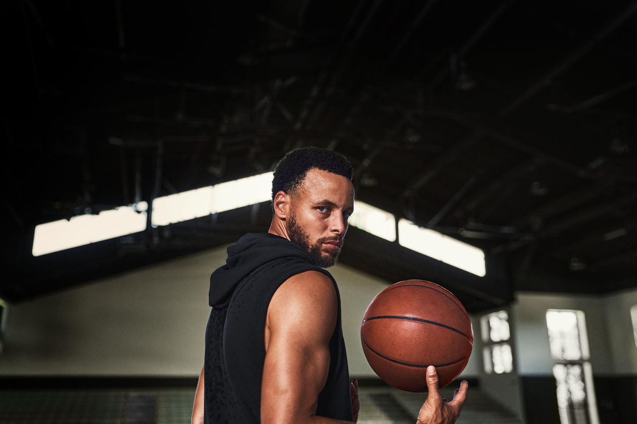Curry Over Shoulder Portrait with basketball in hand