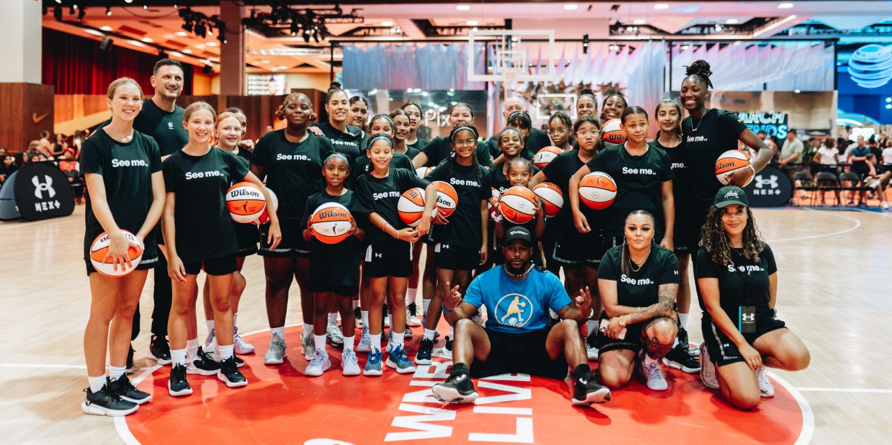 group picture at the middle of a basketball court