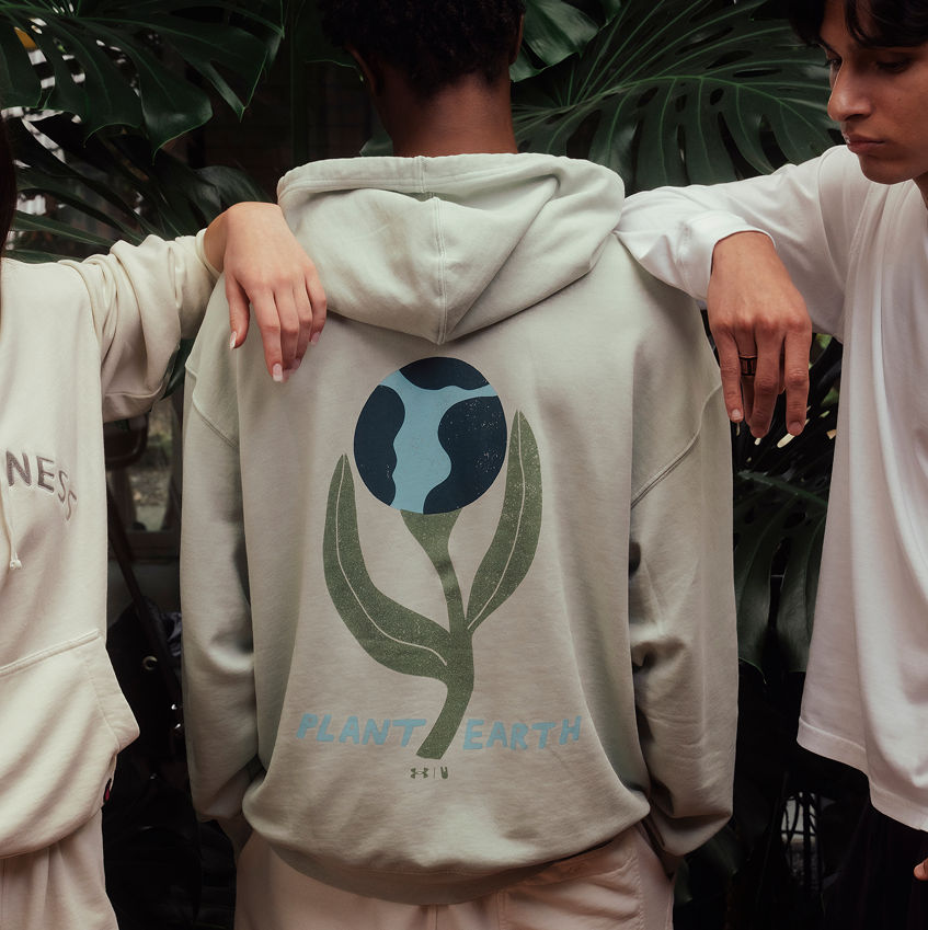 Model back showing behind design of Earth Day hoodie