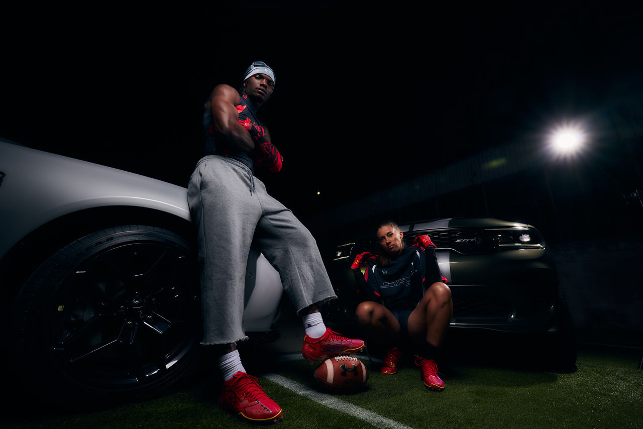 Football Players in UA X Dodge Collection  Posing with Dodge Vehicles