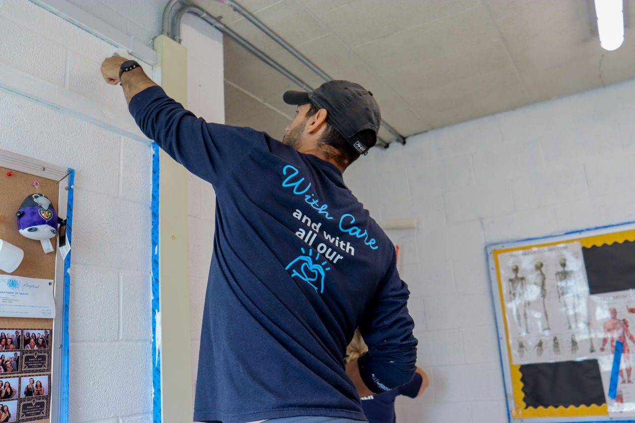 Carefirst and under Armour Volunteer Painting Coaches Room