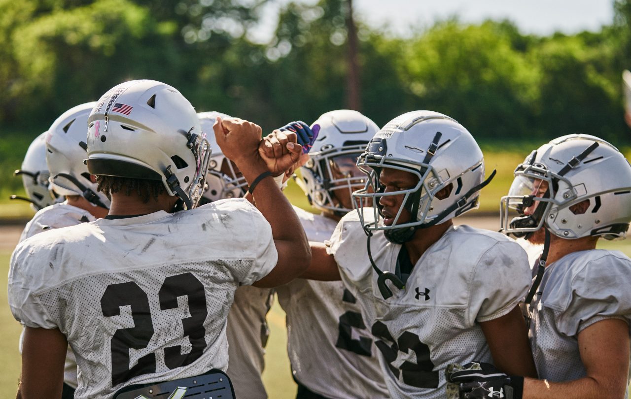 Reunión de fútbol americano de la escuela secundaria