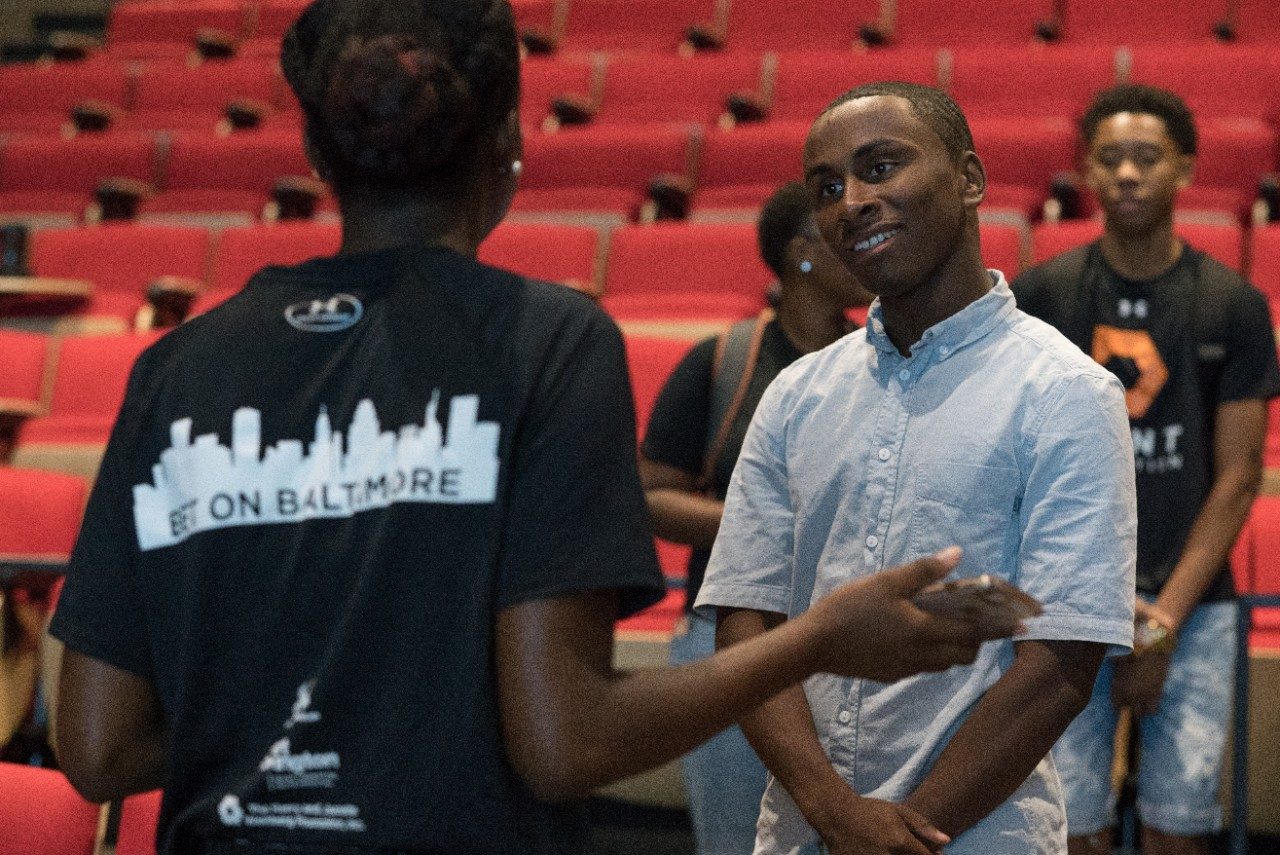 Taz talking to a current student in the program.