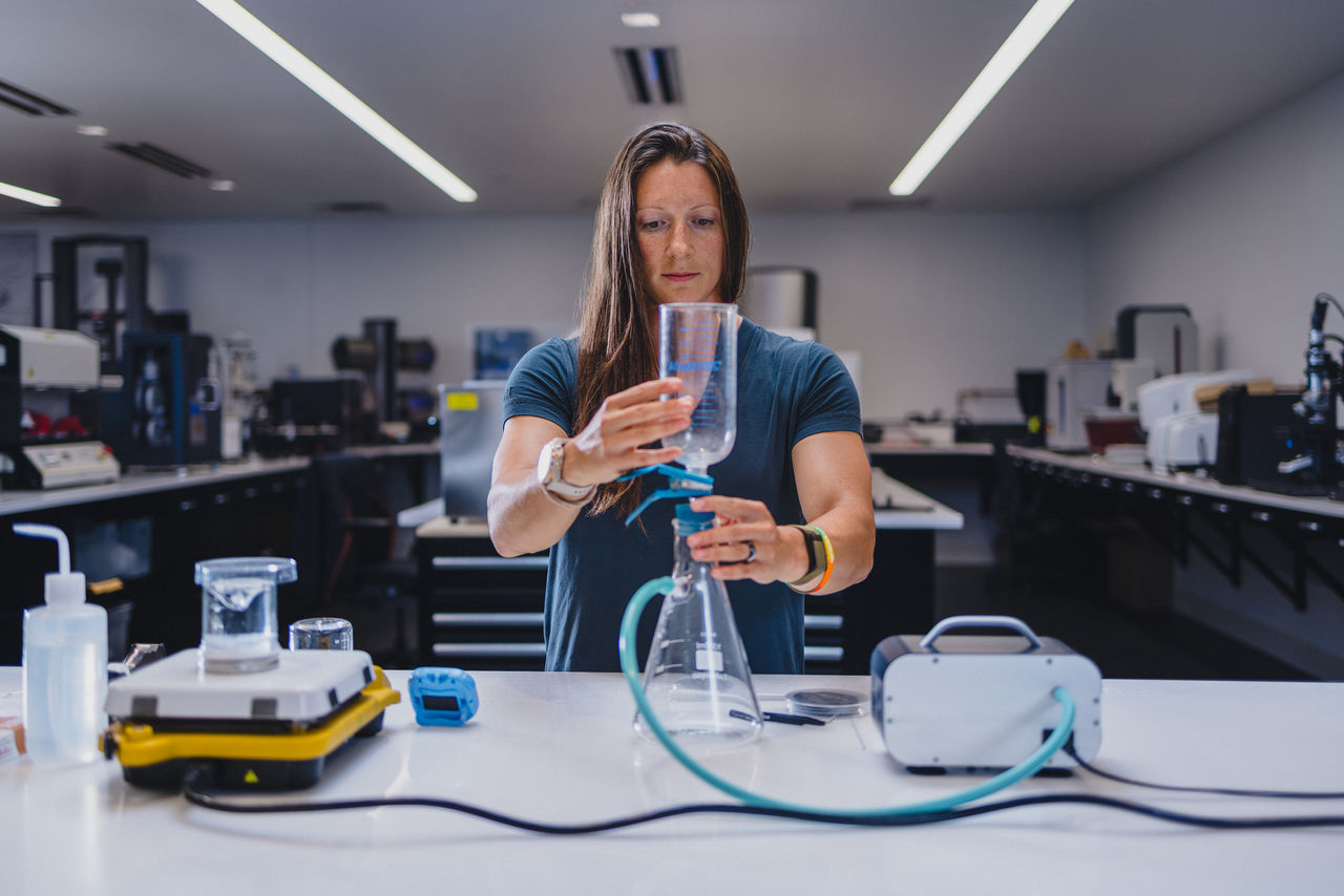 Woman in lab testing fiber shed