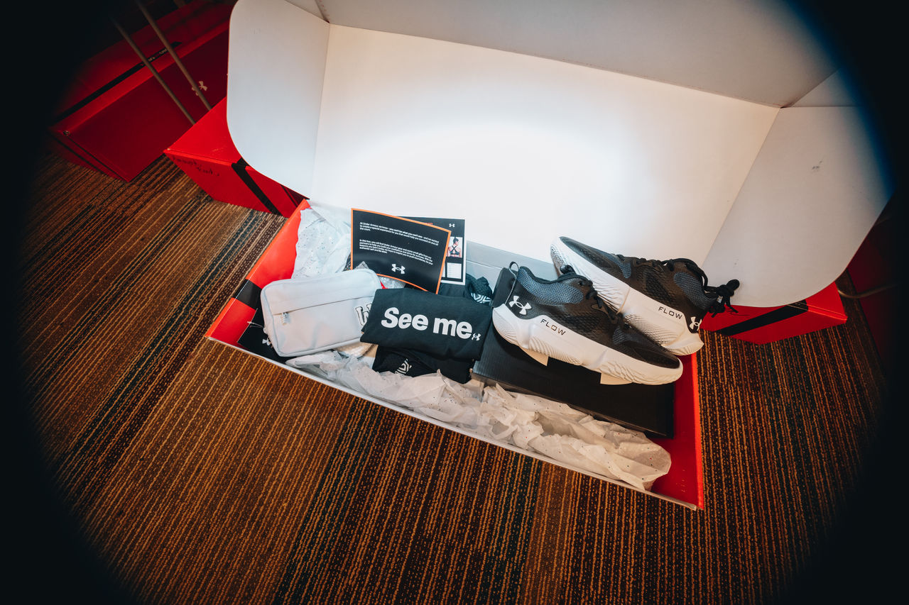 a box with sneakers and other gear