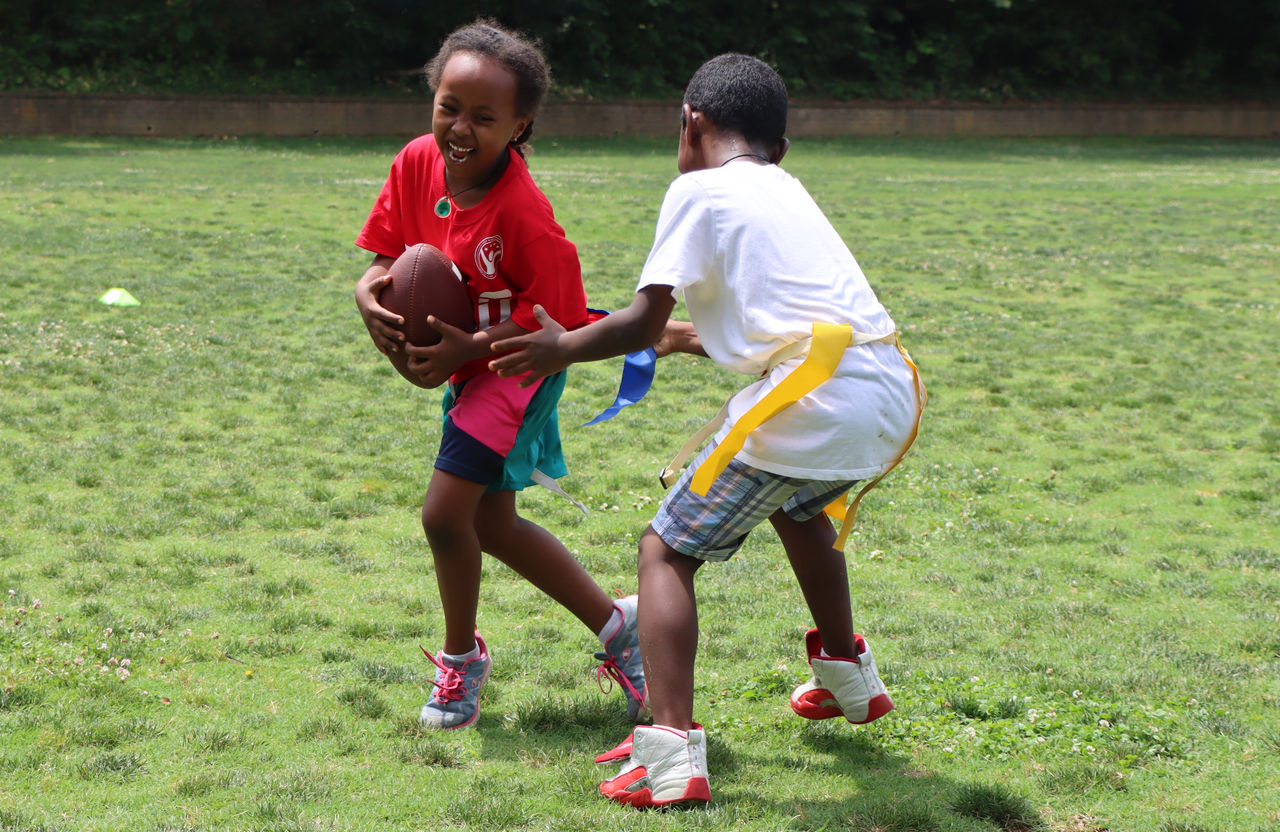 Two Kids Playing Flag Football