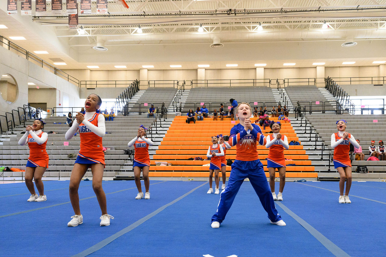 Group of Girls Cheerleading in a Gym