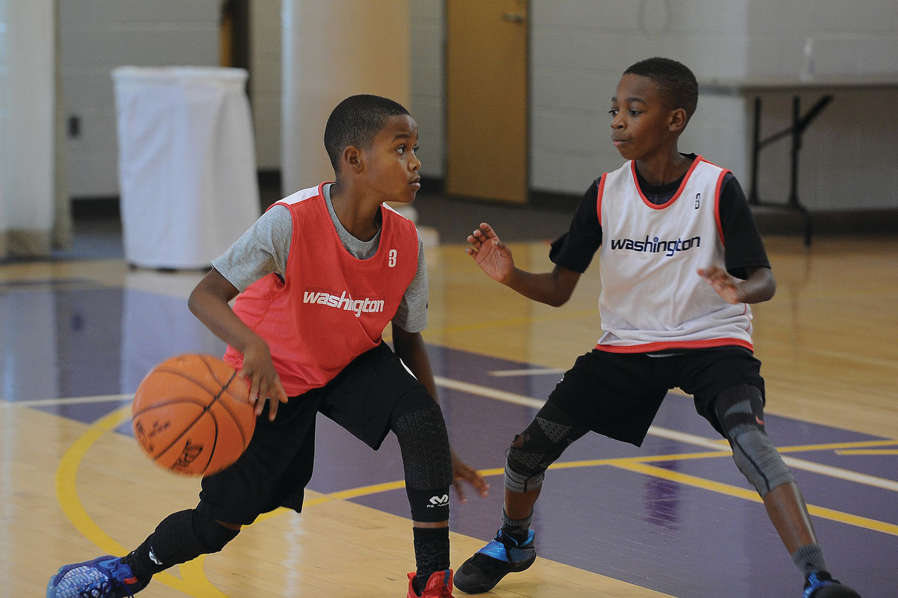 Two Boys Playing Basketball